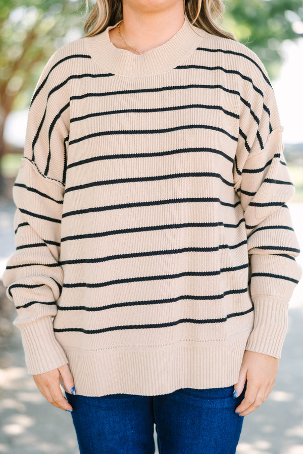 Plus size khaki and black striped knit sweater with a relaxed fit and ribbed crew neckline.