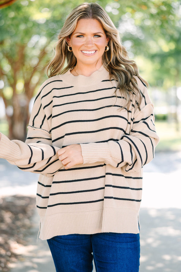 Plus size khaki and black striped knit sweater with a relaxed fit and ribbed crew neckline.