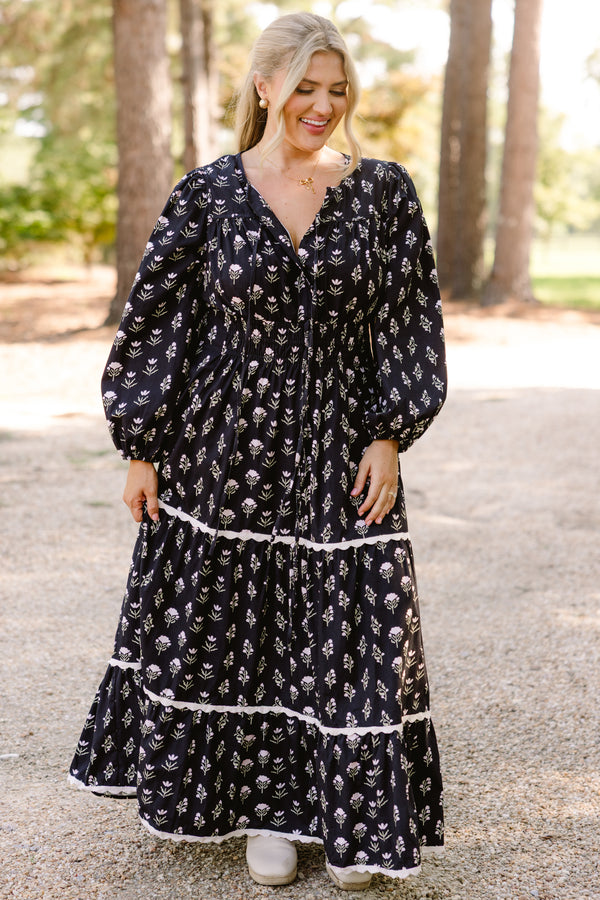 Chic Soul plus size clothing, black long sleeve tiered flowy maxi dress with light pink floral print and white scallops on the tiers 
