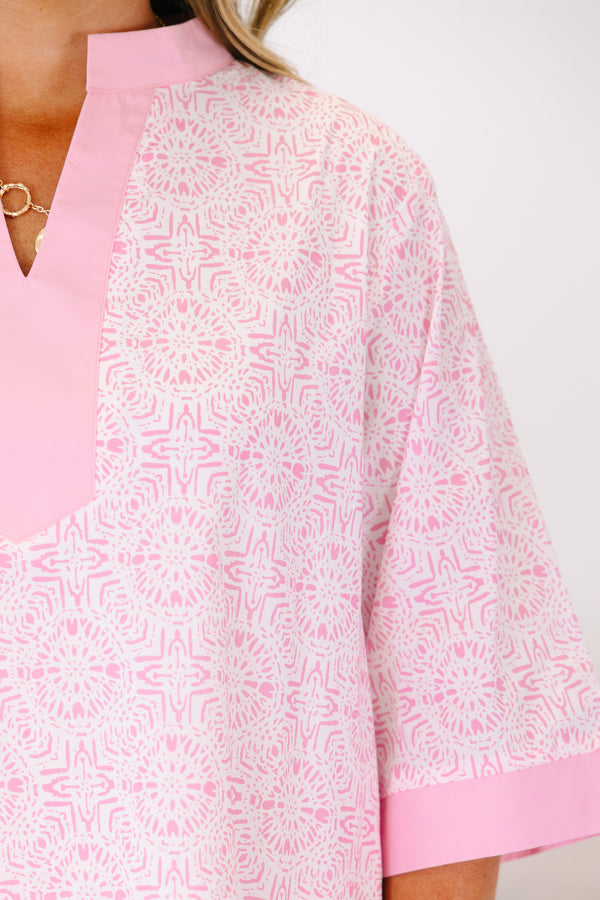 Plus Size pink and white patterned tunic dress with a split neckline and solid pink trim.