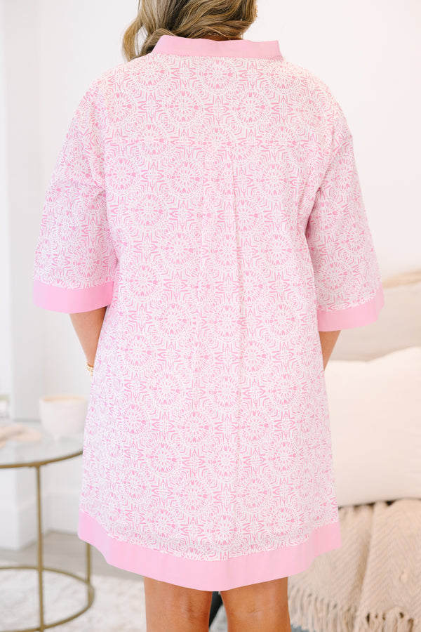 Plus Size pink and white patterned tunic dress with a split neckline and solid pink trim.