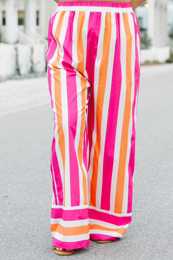 Chic Soul plus size clothing, pink orange and white striped pants with a stretchy waistband as well as a cuff at the bottom of each pant leg that has horizontal stripes 
