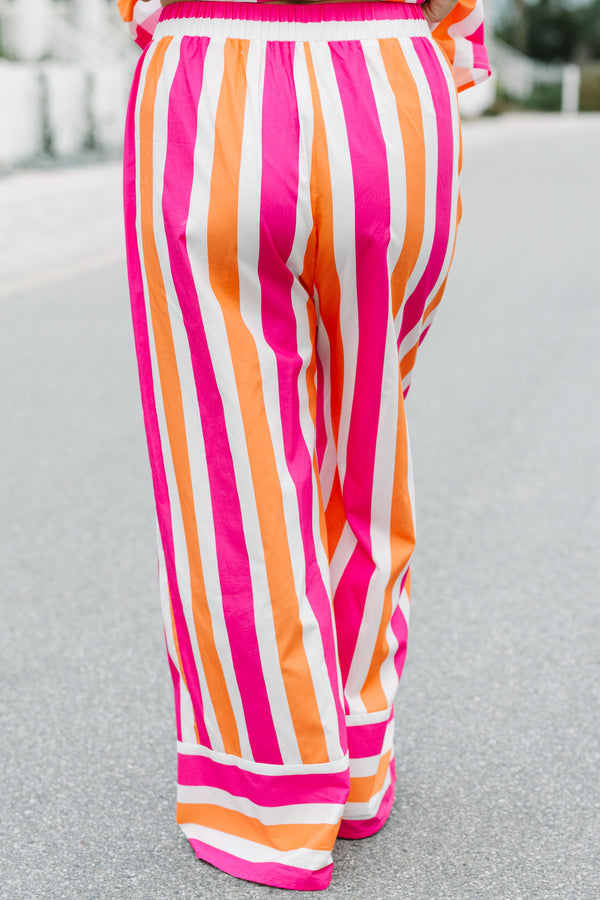 Chic Soul plus size clothing, pink orange and white striped pants with a stretchy waistband as well as a cuff at the bottom of each pant leg that has horizontal stripes 
