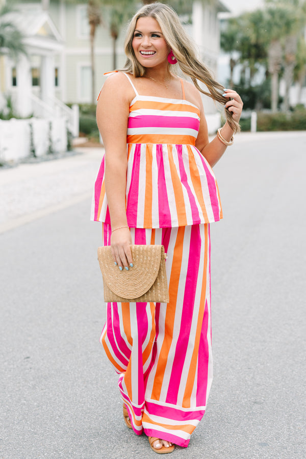 Chic Soul plus size clothing, pink orange and white striped pants with a stretchy waistband as well as a cuff at the bottom of each pant leg that has horizontal stripes 
