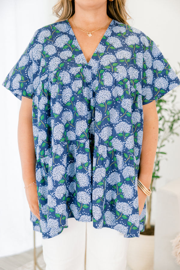 Chic Soul plus size clothing, navy blue short sleeve tiered babydoll top with v neckline and light blue hydrangeas on it
