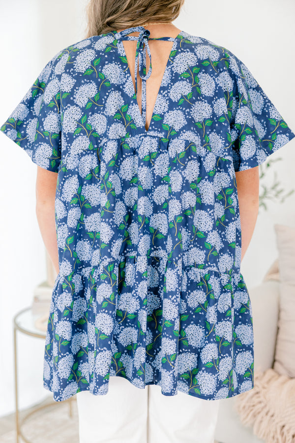 Chic Soul plus size clothing, navy blue short sleeve tiered babydoll top with v neckline and light blue hydrangeas on it
