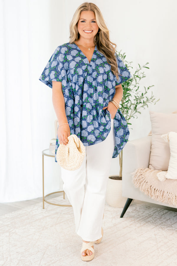 Chic Soul plus size clothing, navy blue short sleeve tiered babydoll top with v neckline and light blue hydrangeas on it
