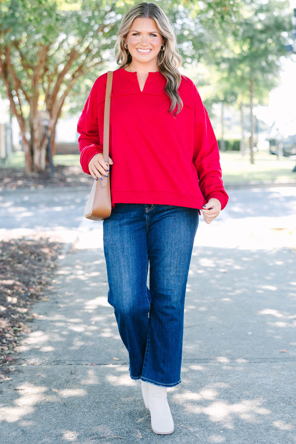 Plus Size crimson tunic sweatshirt with a split v-neckline, dropped shoulders, and raw seam details.