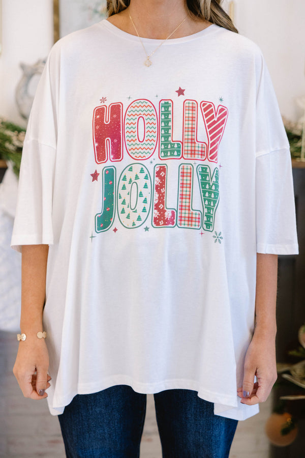 Chic Soul plus size clothing, white short sleeve boyfriend tee with “Holly Jolly” text in the middle with green and red holiday pattern on the inside and stars and snowflakes surrounding it
