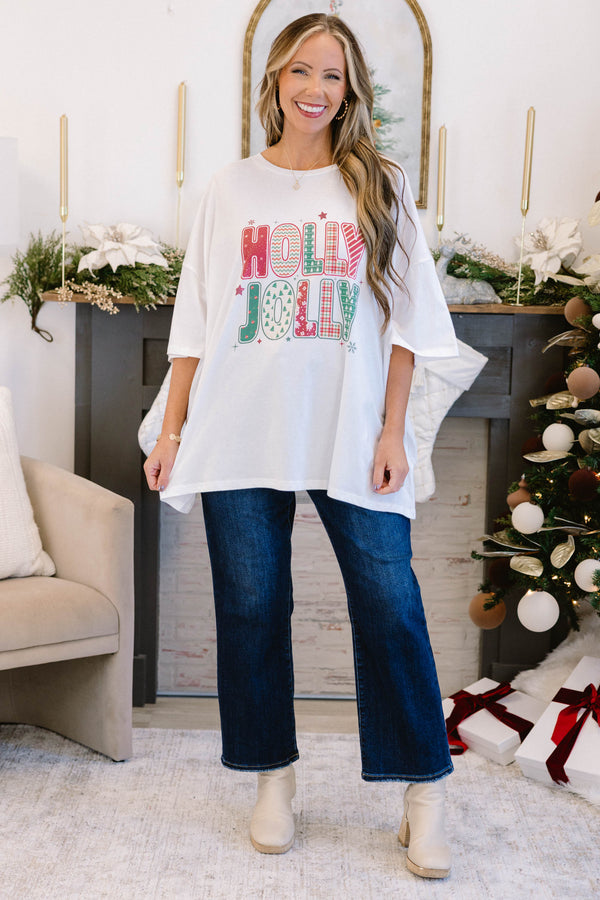 Chic Soul plus size clothing, white short sleeve boyfriend tee with “Holly Jolly” text in the middle with green and red holiday pattern on the inside and stars and snowflakes surrounding it