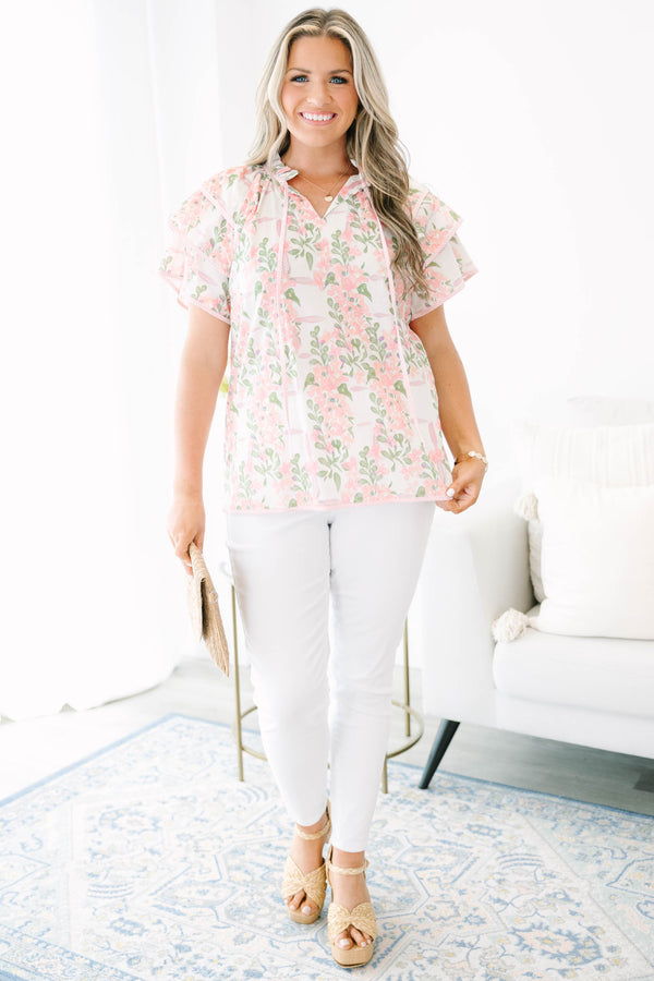 Plus Size pink and green floral print top with ruffled short sleeves and a tie-neckline.