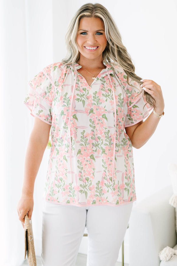 Plus Size pink and green floral print top with ruffled short sleeves and a tie-neckline.