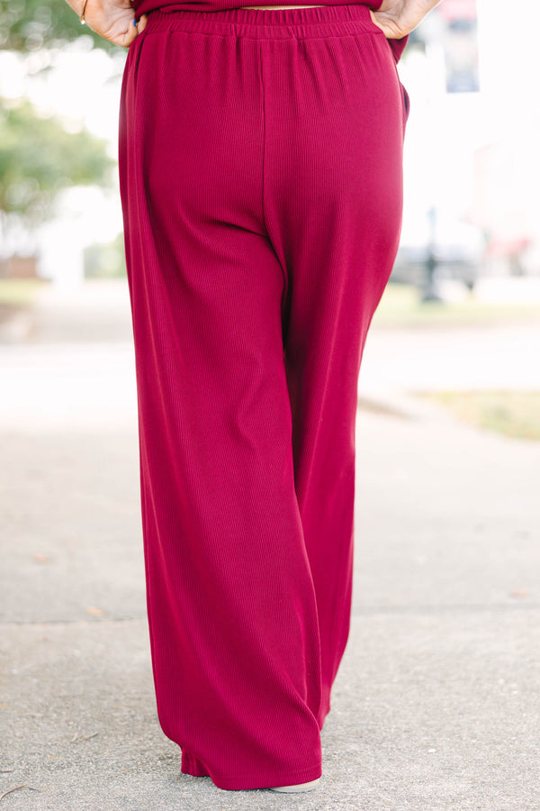 Plus Size red two-piece set with a ribbed short-sleeve crewneck top and matching wide-leg pants.