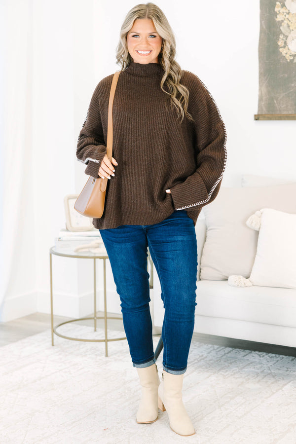 Plus Size brown ribbed knit sweater with a high neckline and white whipstitch trim on the sleeves.