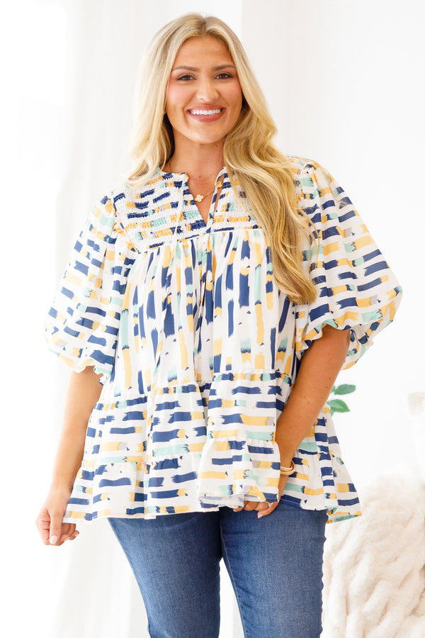 Chic Soul Plus size clothing, blue baby doll top with and muti-color blue and yellow abstract pattern and bubble sleeves 

