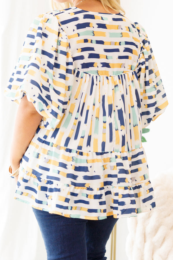Chic Soul Plus size clothing, blue baby doll top with and muti-color blue and yellow abstract pattern and bubble sleeves 
