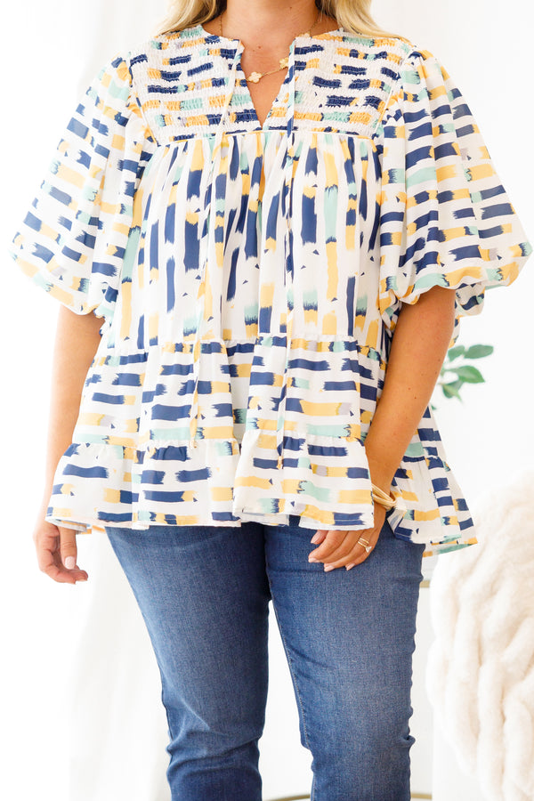 Chic Soul Plus size clothing, blue baby doll top with and muti-color blue and yellow abstract pattern and bubble sleeves 

