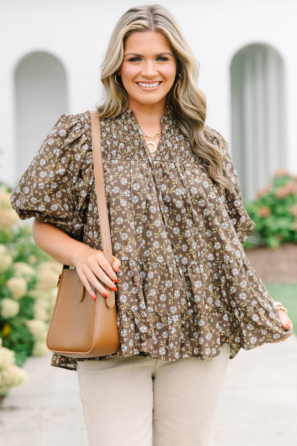 Plus Size brown floral babydoll top with smocked split v-neck, tassels, and elastic puff sleeves.