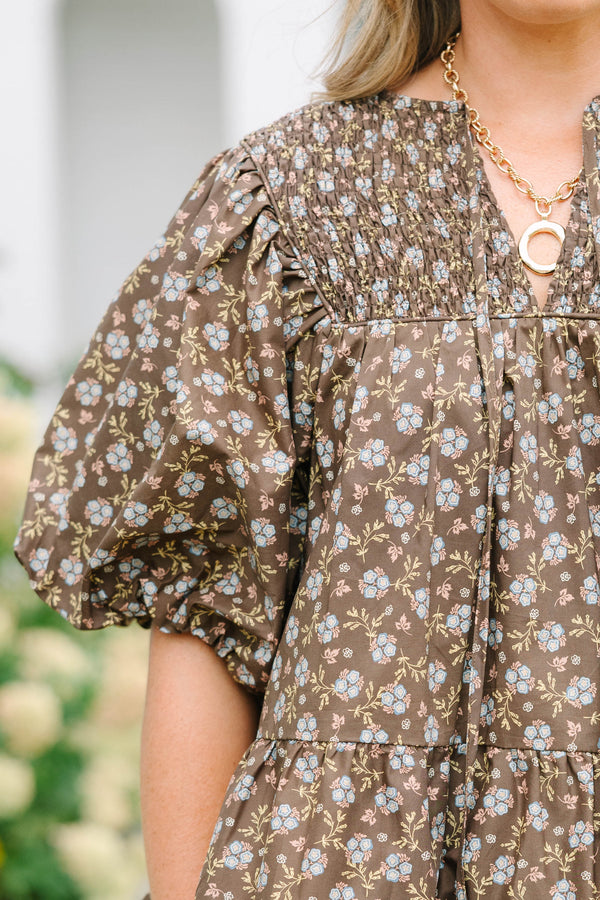 Plus Size brown floral babydoll top with smocked split v-neck, tassels, and elastic puff sleeves.