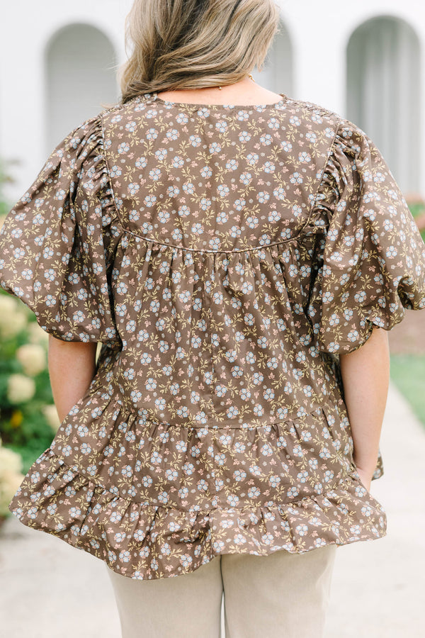 Plus Size brown floral babydoll top with smocked split v-neck, tassels, and elastic puff sleeves.