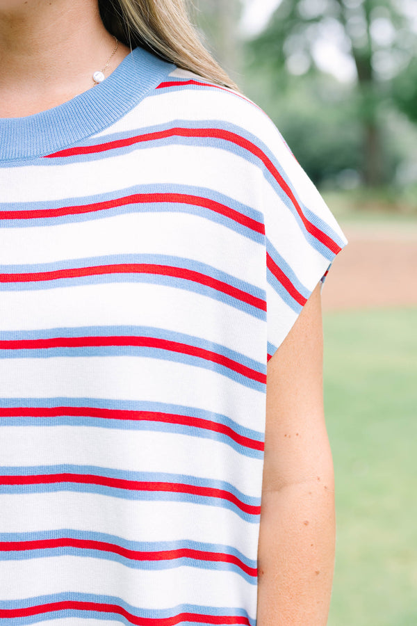 Plus size cream short sleeve sweater top with red and blue stripes and a flowy fit.