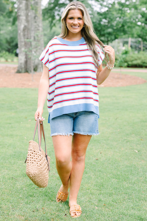 Plus size cream short sleeve sweater top with red and blue stripes and a flowy fit.