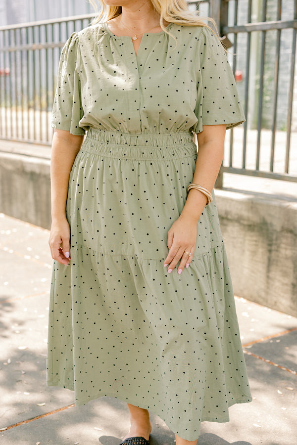 Chic Soul plus size clothing, olive green short sleeve tiered maxi dress with small black polka dots that cinches at the waist
