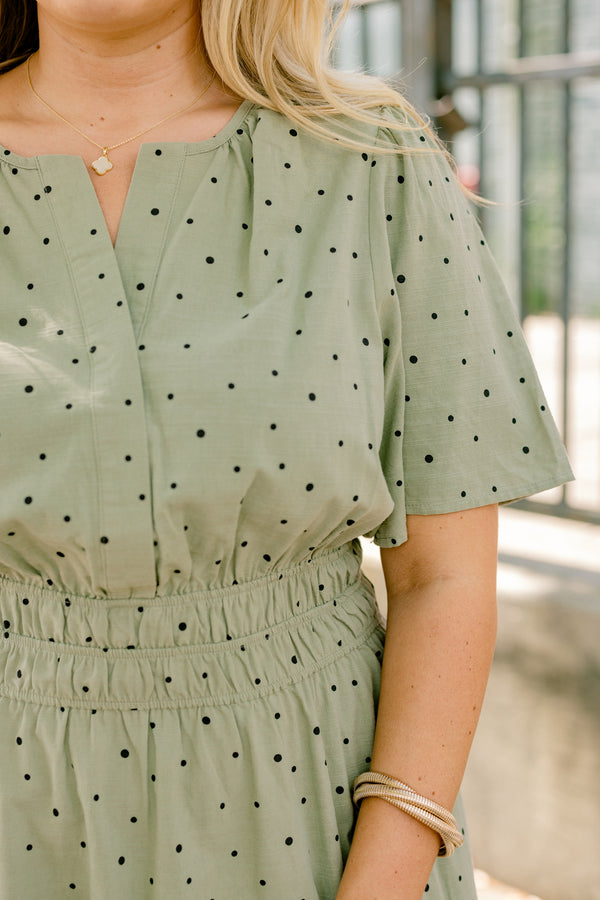 Chic Soul plus size clothing, olive green short sleeve tiered maxi dress with small black polka dots that cinches at the waist