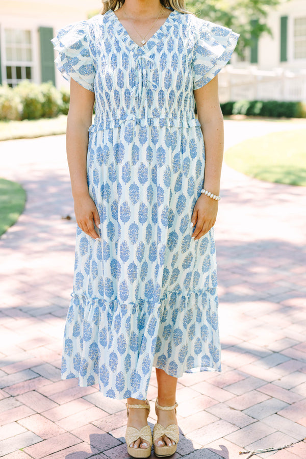Plus Size blue and white patterned midi dress with flutter sleeves and a smocked bodice.