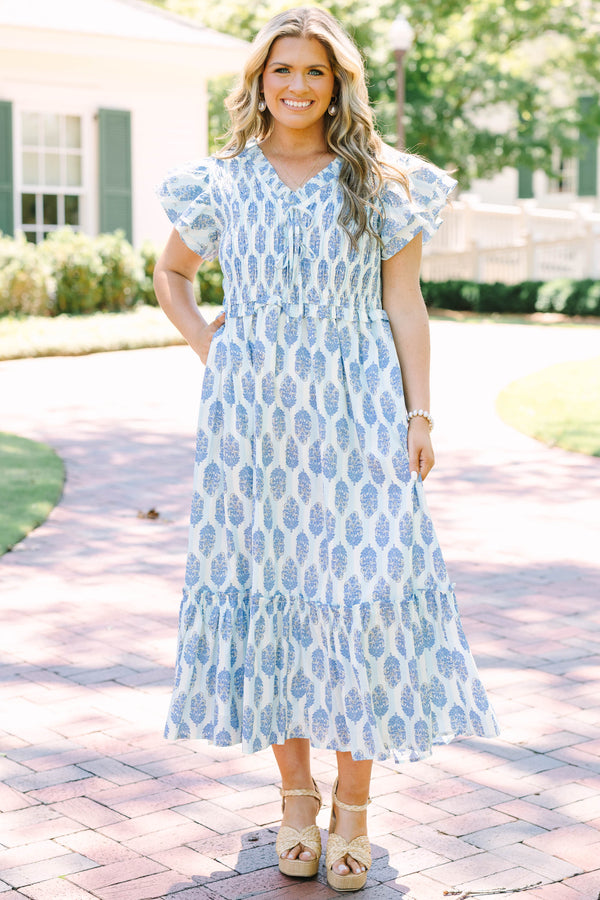 Plus Size blue and white patterned midi dress with flutter sleeves and a smocked bodice.