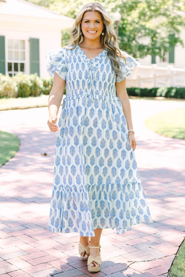 Plus Size blue and white patterned midi dress with flutter sleeves and a smocked bodice.