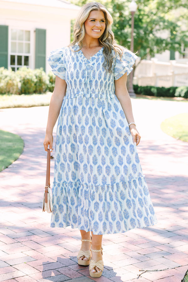Plus Size blue and white patterned midi dress with flutter sleeves and a smocked bodice.