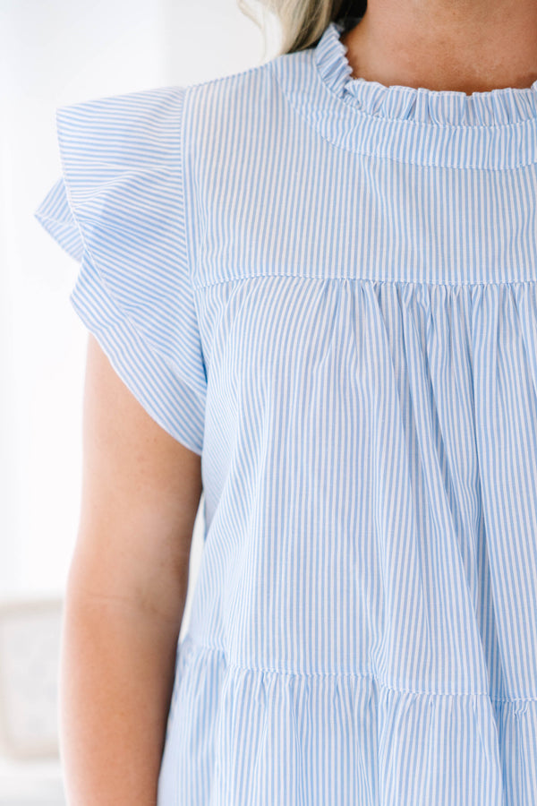 Plus Size blue and white striped babydoll top with ruffled cap sleeves and a high ruffled neckline.