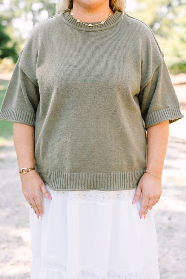 Plus Size olive green knit sweater with a crew neckline and elbow-length sleeves.