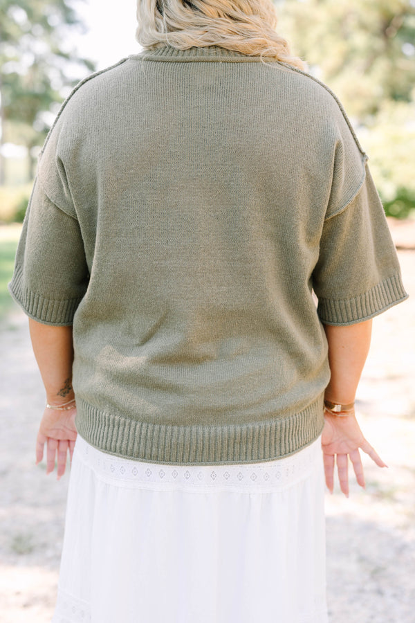 Plus Size olive green knit sweater with a crew neckline and elbow-length sleeves.