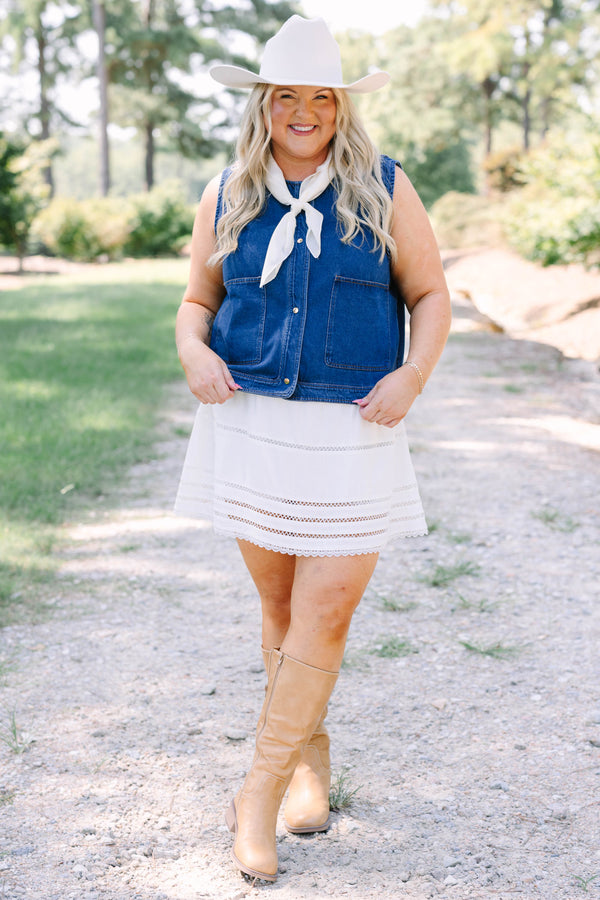 Plus Size dark denim vest with gold buttons, large front pockets, and a sleeveless design.