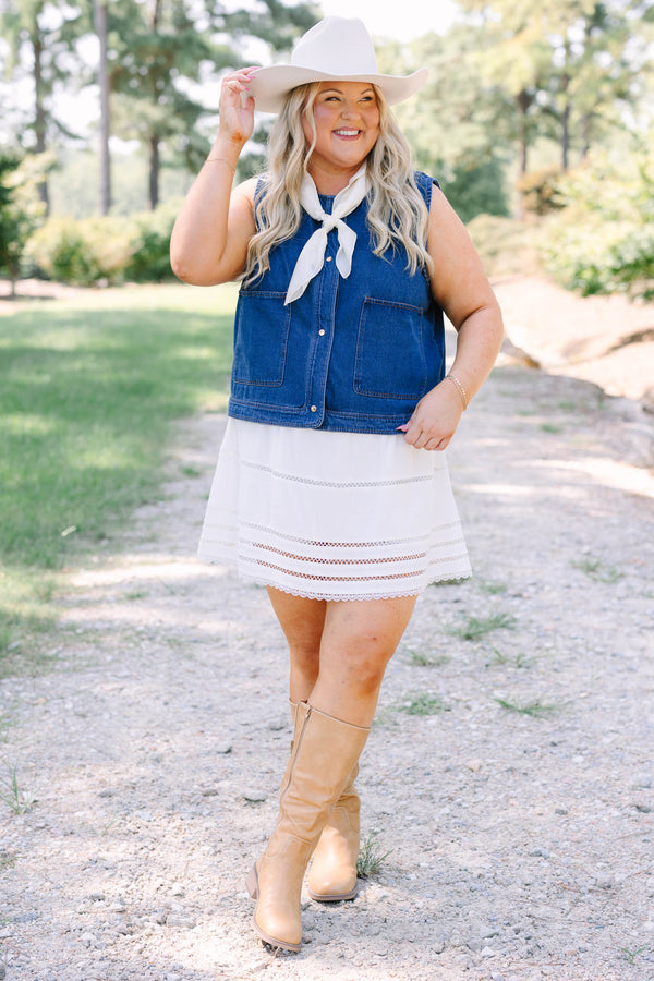 Plus Size dark denim vest with gold buttons, large front pockets, and a sleeveless design.