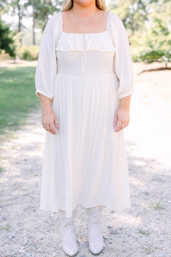 Plus Size cream midi dress with ruffle neckline, tiered bodice, and flowy three-quarter sleeves.