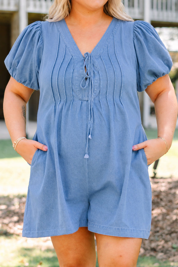 Plus Size denim romper with puff sleeves, a tie-front V-neckline, and pleated bodice details.