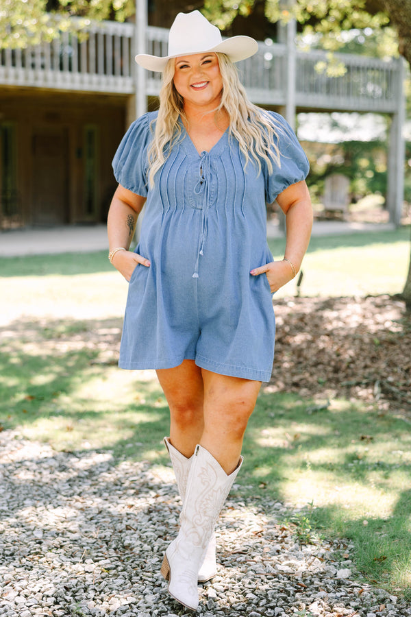 Plus Size denim romper with puff sleeves, a tie-front V-neckline, and pleated bodice details.