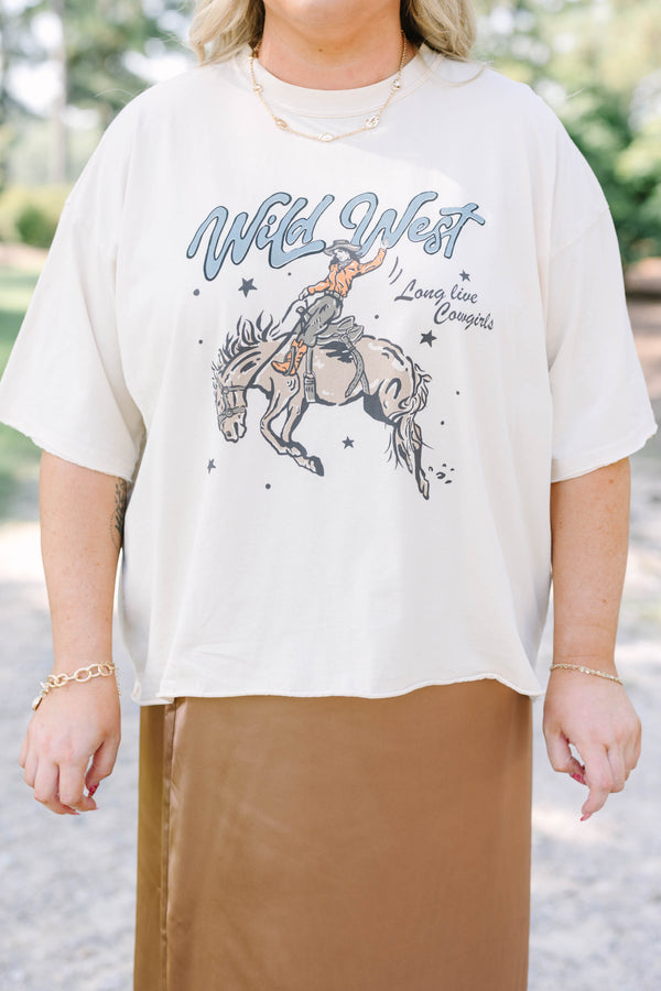 Plus Size sand vintage wash tee with a Wild West cowgirl graphic and a brown satin midi skirt.