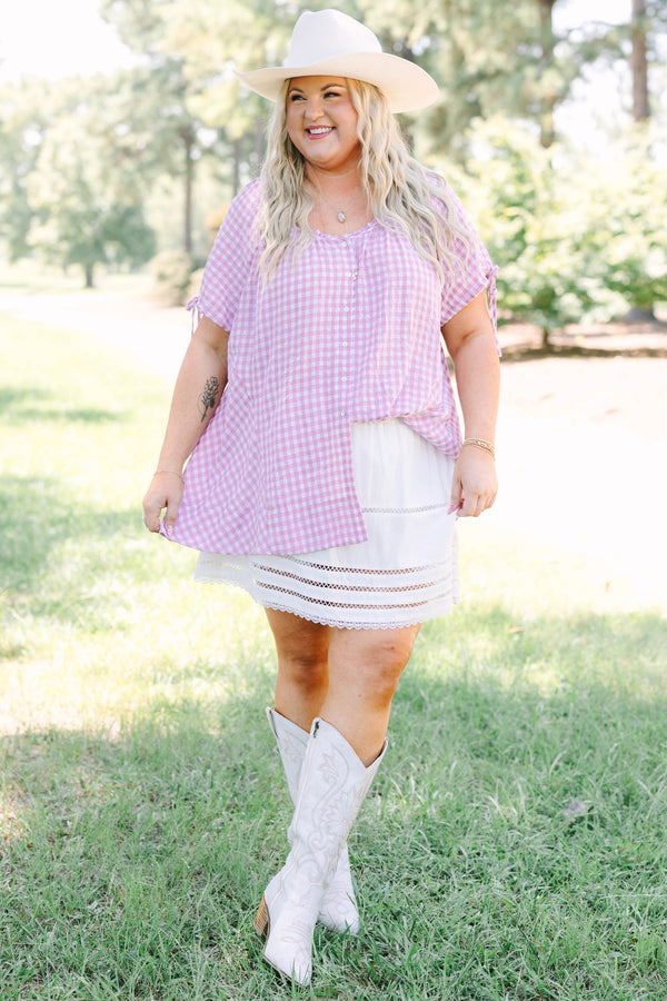 Plus Size pink and white gingham tunic with short tie-sleeves and a button-down front.