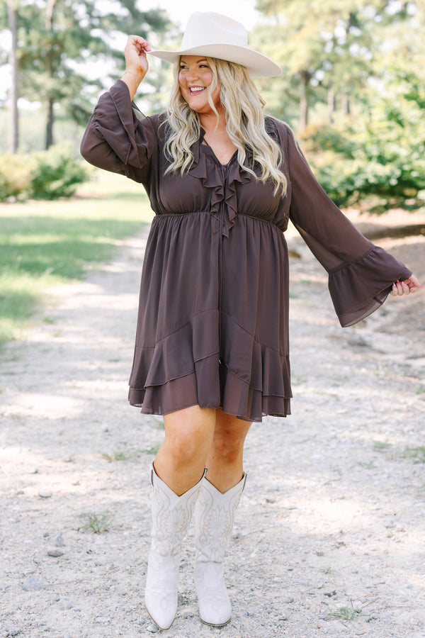 Plus Size brown long sleeve dress with a ruffled V-neckline, tiered skirt, and bell sleeves.