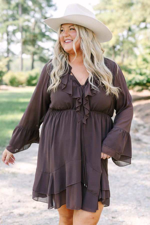 Plus Size brown long sleeve dress with a ruffled V-neckline, tiered skirt, and bell sleeves.