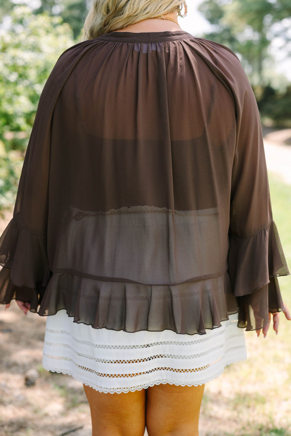 Plus Size brown long sleeve top with ruffle trim, lace-up neckline, and tiered bell sleeves.