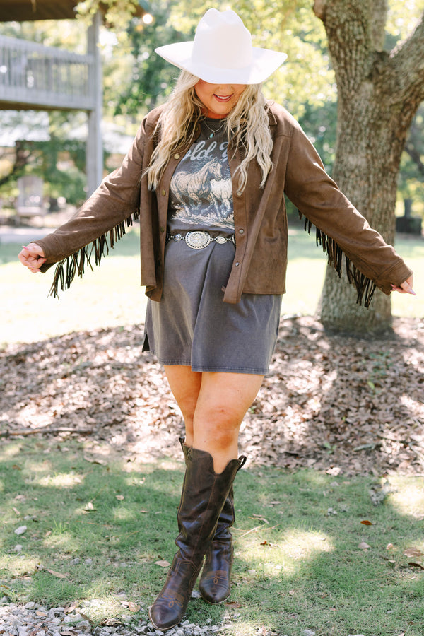 Plus Size brown suede-like jacket with fringe sleeves over a graphic tee and concho belt.