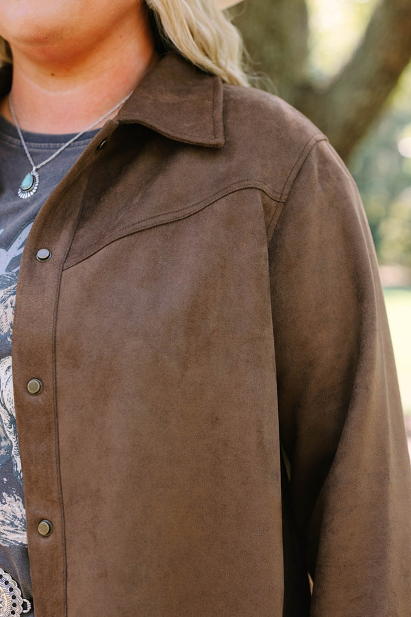 Plus Size brown suede-like jacket with fringe sleeves over a graphic tee and concho belt.