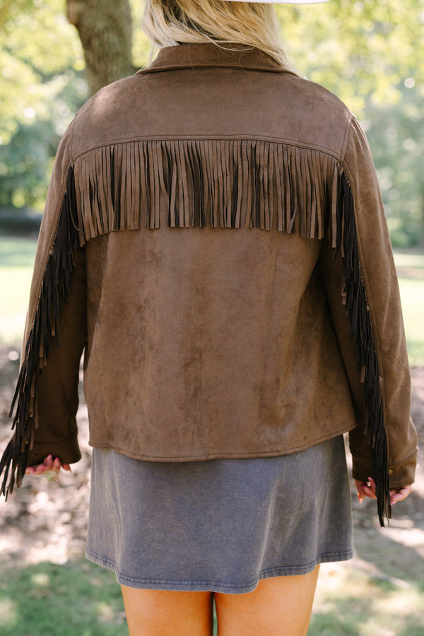 Plus Size brown suede-like jacket with fringe sleeves over a graphic tee and concho belt.