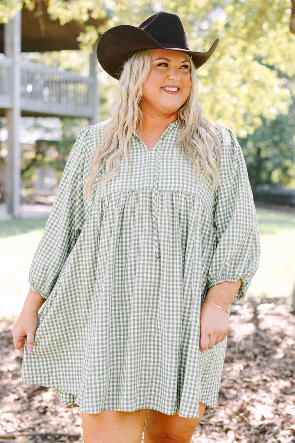 Plus Size green and white gingham babydoll dress with a v-neckline and three-quarter length sleeves.