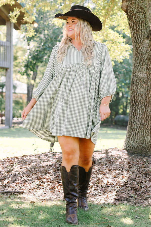Plus Size green and white gingham babydoll dress with a v-neckline and three-quarter length sleeves.